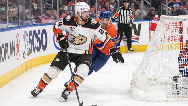 Anaheim Ducks' Benoit-Olivier Groulx (24) and Edmonton Oilers' Connor McDavid (97) battle for the puck during first period NHL action in Edmonton. (Jason Franson/CP)