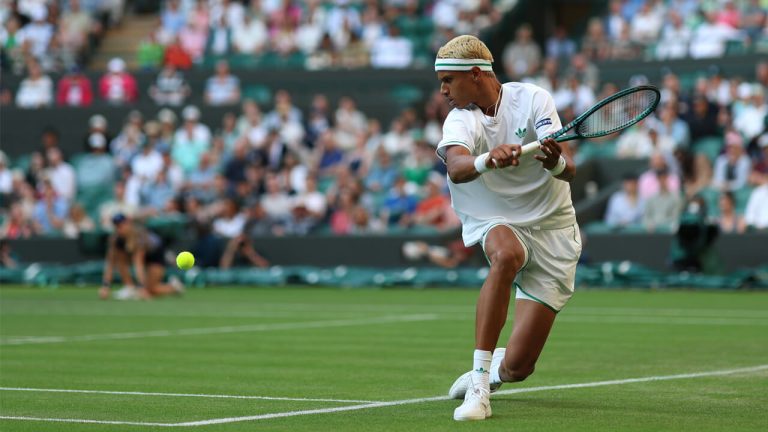 Gabriel Diallo plays a backhand against America's Taylor Fritz at Wimbledon 2025. (Photo by Dan Istitene/Getty Images)
