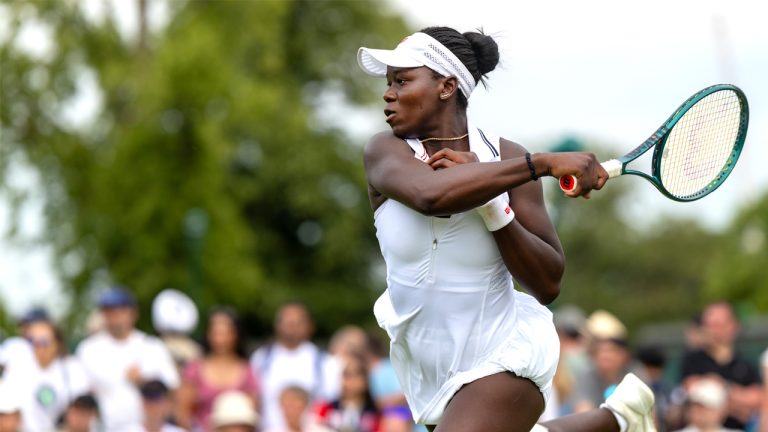 Victoria Mboko sends a forehand at Poland's Magdalena Frech during first-round action at Wimbledon in July 2025. (Photo by Tim Clayton/Getty Images)