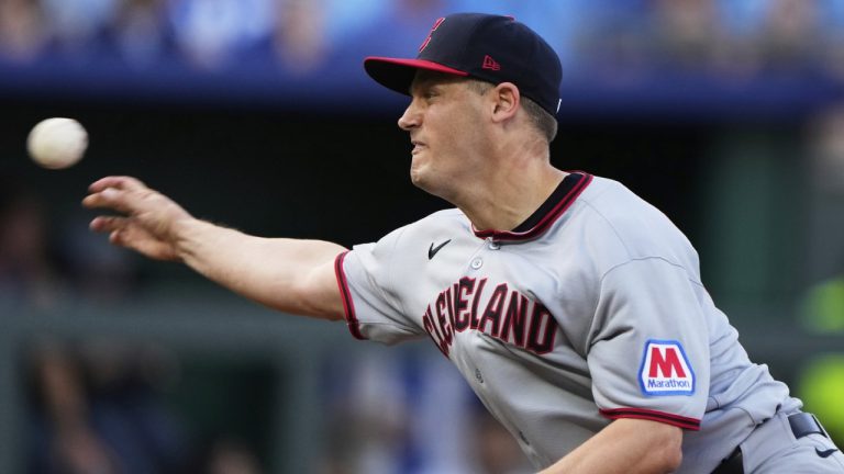FILE - Cleveland Guardians relief pitcher Paul Sewald throws during the 10th inning of a baseball game against the Kansas City Royals, March 27, 2025, in Kansas City, Mo. (AP Photo/Charlie Riedel, File)