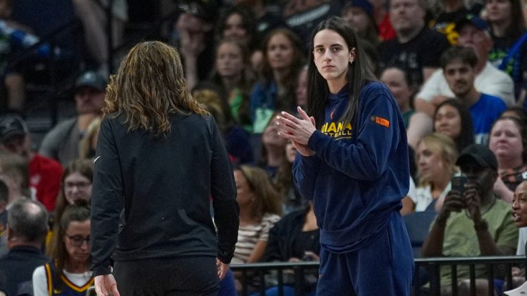 Indiana Fever guard Caitlin Clark claps during the WNBA Commissioner's Cup championship game against the Minnesota Lynx, Tuesday, July 1, 2025, in Minneapolis. (AP Photo/Abbie Parr)