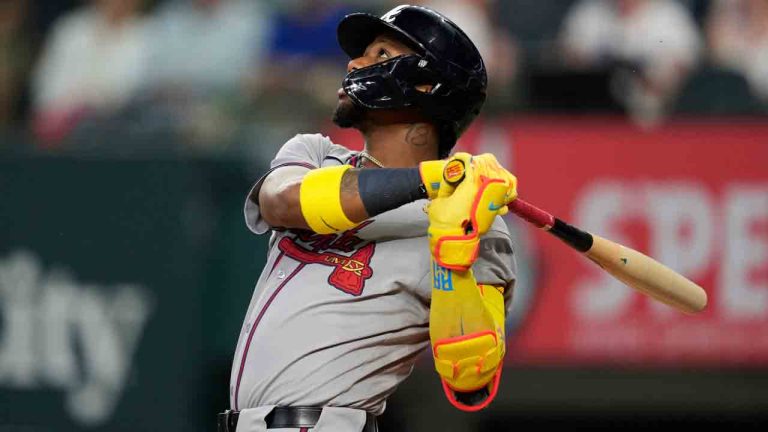 Atlanta Braves' Ronald Acuna Jr. follows through on a fly out to left in the first inning of a baseball game against the Texas Rangers Sunday, July 27, 2025, in Arlington, Texas. (Tony Gutierrez/AP)