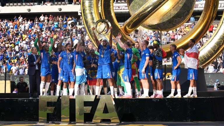 Chelsea's Tosin Adarabioyo holds up the Club World Cup trophy after defeating Paris Saint-Germain in the Club World Cup final soccer match in East Rutherford, N.J., Sunday, July 13, 2025. (AP Photo/Frank Franklin II)