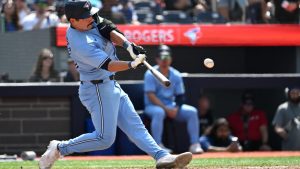 Toronto Blue Jays second baseman Davis Schneider hits a single against the Detroit Tigers in eighth inning American League baseball action in Toronto on Sunday, July 21, 2024. (CP/Jon Blacker)