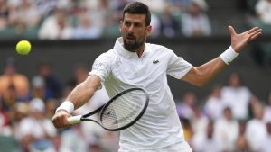 Novak Djokovic of Serbia returns to Miomir Kecmanovic of Serbia during a third round men's singles match at the Wimbledon Tennis Championships in London, Saturday, July 5, 2025. (AP/Kirsty Wigglesworth)