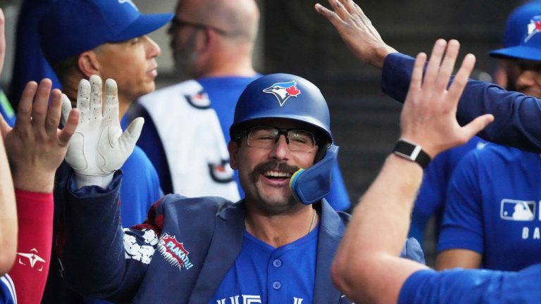 Toronto Blue Jays' Davis Schneider celebrates with teammates after hitting a solo home run during the third inning of a baseball game against the Chicago White Sox in Chicago, Tuesday, July 8, 2025. (Nam Y. Huh/AP)