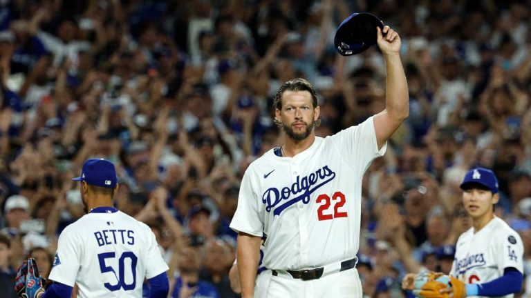 Los Angeles Dodgers pitcher Clayton Kershaw (22) tips his cap after recording his 3,000th career strike out by striking out Chicago White Sox's Vinny Capra during the sixth inning of a baseball game. (Kevork Djansezian/AP)