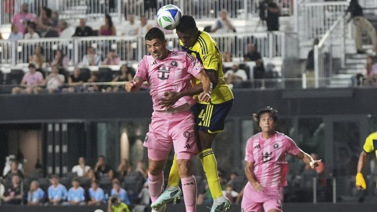 Inter Miami forward Luis Suarez heads the ball against Nashville SC defender Jeisson Palacios during the second half of an MLS match, Saturday, July 12, 2025, in Fort Lauderdale, Fla. (AP/Lynne Sladky)