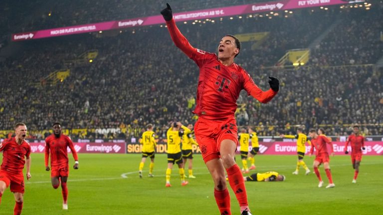 Bayern's Jamal Musiala celebrates after scoring during the German Bundesliga soccer match between Borussia Dortmund and Bayern Munich at the Signal-Iduna Park in Dortmund, Germany, Saturday, Nov. 30, 2024. (Martin Meissner/AP)