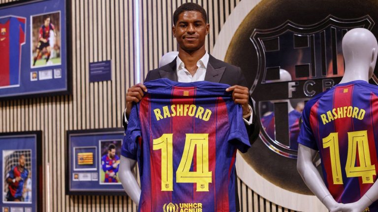 Marcus Rashford poses with an F.C. Barcelona jersey during his presentation as a new signing in Barcelona, Spain, Wednesday, July 23, 2025. (Joan Monfort/AP)