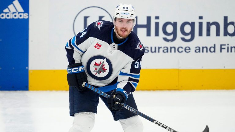 Winnipeg Jets defenceman Dylan Samberg works against the Dallas Stars during a game in Dallas, Thursday, April 11, 2024. (Tony Gutierrez/AP)
