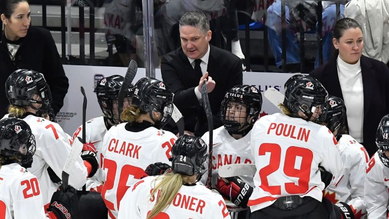 Canada head coach Troy Ryan, top, instructs his players during the third period in the final against the United States at the IIHF Women's World Hockey Championships in Utica, N.Y., Sunday, April 14, 2024. (Adrian Kraus/AP)