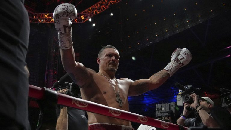 Ukraine's Oleksandr Usyk celebrates winning the undisputed world heavyweight boxing title fight against Britain's Daniel Dubois in London, Saturday, July 19, 2025. (Frank Augstein/AP)