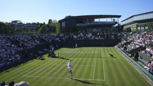 Matteo Berrettini of Italy serves to Kamil Majchrzak of Poland in their first round men's singles match at the Wimbledon Tennis Championships in London, Monday, June 30, 2025. (Joanna Chan/AP)