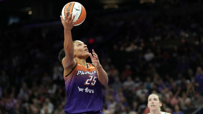 Phoenix Mercury forward Alyssa Thomas drives past Minnesota Lynx forward Bridget Carleton to score during the second half of a WNBA game Wednesday, July 9, 2025, in Phoenix. (Ross D. Franklin/AP)