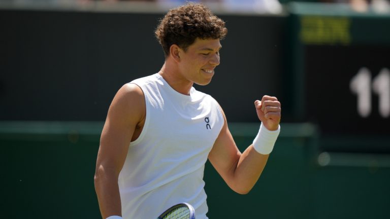 Ben Shelton of the U.S. celebrates winning the men's singles second round match against Rinky Hijikata of Australia at the Wimbledon Tennis Championships in London, Friday, July 4, 2025.(Alastair Grant/AP)