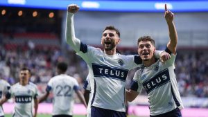 Vancouver Whitecaps' Tristan Blackmon, left, and Sebastian Berhalter celebrate Blackmon's goal against Real Salt Lake during the second half of an MLS soccer match, in Vancouver, on Saturday, May 3, 2025. (Darryl Dyck/CP)