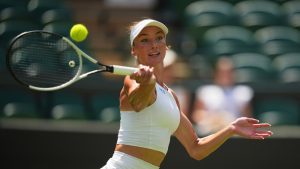 Carson Branstine of Canada returns the ball to Aryna Sabalenka of Belarus during their first round women's single match at the Wimbledon Tennis Championships in London, Monday, June 30, 2025. (Kin Cheung/AP Photo)
