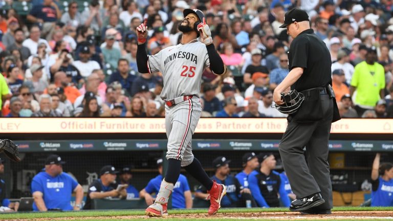 Minnesota Twins' Byron Buxton (25) reacts after hitting a home run as home plate Todd Tichenor, right, looks on during the fifth inning of a baseball game against the Detroit Tigers, Friday, June 27, 2025, in Detroit. (Jose Juarez/AP)