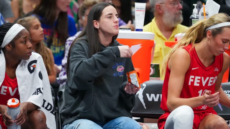 Indiana Fever guard Caitlin Clark eats Goldfish crackers during the first half of a WNBA basketball game against the Dallas Wings Friday, June 27, 2025, in Dallas. (Julio Cortez/AP)
