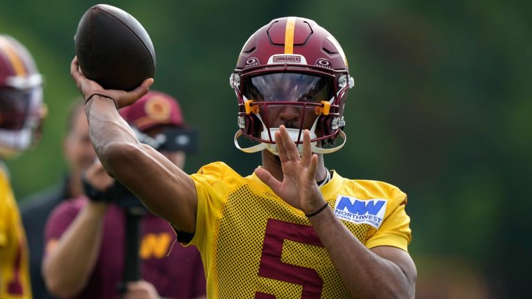 Washington Commanders quarterback Jayden Daniels (5) throws during practice at the team's NFL football training camp, Wednesday, July 23, 2025, in Ashburn, Va. (Mark Schiefelbein/AP)