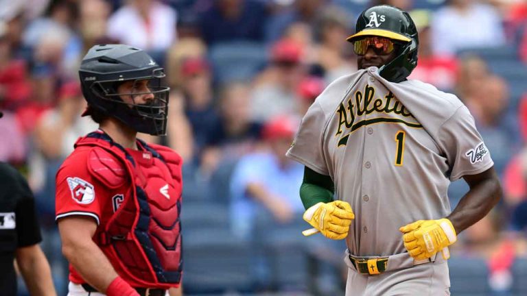 Athletics' Denzel Clarke, right, reacts after scoring on an RBI double by Nick Kurtz during the eighth inning of a baseball game against the Cleveland Guardians. (David Dermer/AP)