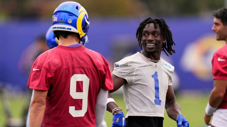 Los Angeles Rams cornerback Derion Kendrick, right, talks with quarterback Matthew Stafford while wearing grillz during the NFL football team's organized team activities Wednesday, May 28, 2025, in Los Angeles. (Mark J. Terrill/AP)
