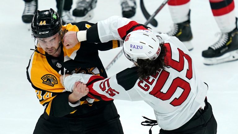 New Jersey Devils defenceman Mason Geertsen (55) throws a punch during his fight with Boston Bruins defenceman Josh Brown (44) during the first period of an NHL hockey game Thursday, March 31, 2022, in Boston. (Charles Krupa/AP Photo)