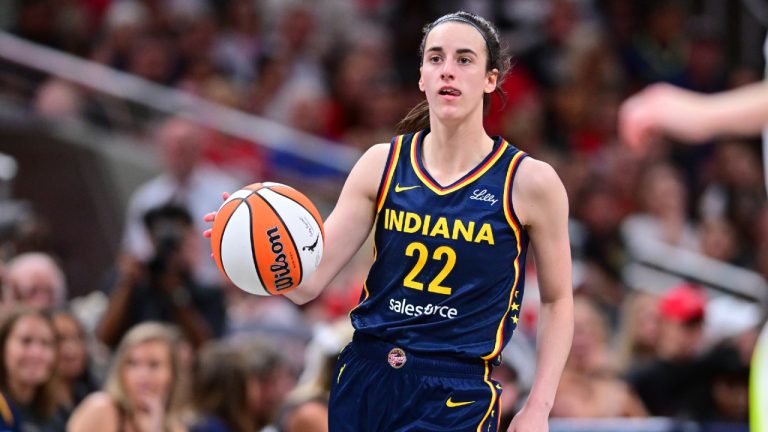 Indiana Fever's Caitlin Clark dribbles during the second half of a WNBA basketball game against the Dallas Wings, Sunday, July 13, 2025, in Indianapolis. (Doug McSchooler/AP)