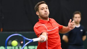 Alexis Galarneau, of Canada, plays a shot to Fabian Marozsan, of Hungary, during their Davis Cup qualifying tennis match in Montreal on Saturday, February 1, 2025. (Graham Hughes/CP)