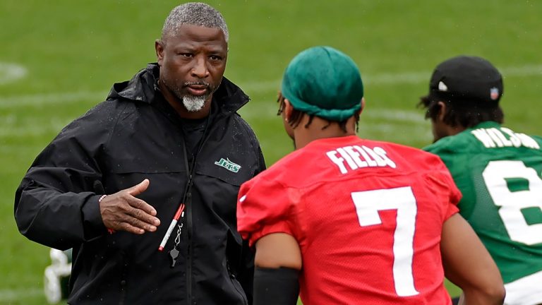 New York Jets head coach Aaron Glenn reaches to shake hands with Justin Fields during practice at NFL football minicamp, Tuesday, June 10, 2025, in Florham Park, N.J. (Adam Hunger/AP)