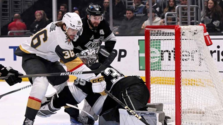 Los Angeles Kings goaltender Darcy Kuemper (35) stops a shot by Vegas Golden Knights center Raphael Lavoie (36) with Kings defenseman Drew Doughty (8) defending during the first period of an NHL hockey game. (Alex Gallardo/AP)