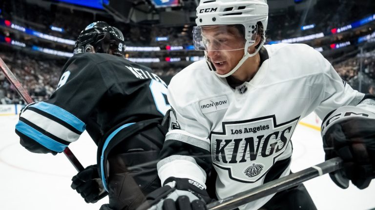 Utah Hockey Club forward Clayton Keller, left, pushes Los Angeles Kings centre Jack Studnicka, right, into the boards during the first period of a pre-season NHL hockey game, Monday, Sept. 23, 2024, in Salt Lake City. (Spenser Heaps/AP)