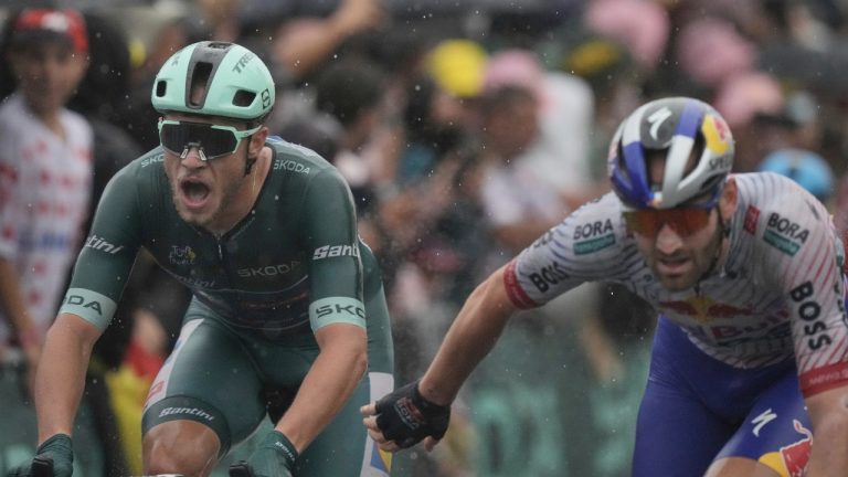 Italy's Jonathan Milan, left, sprints ahead of Belgium's Jordi Meeus to win the seventeenth stage of the Tour de France cycling race over 160.4 kilometers (99.7 miles) with start in Bollene and finish in Valence, France, Wednesday, July 23, 2025. (Thibault Camus/AP)