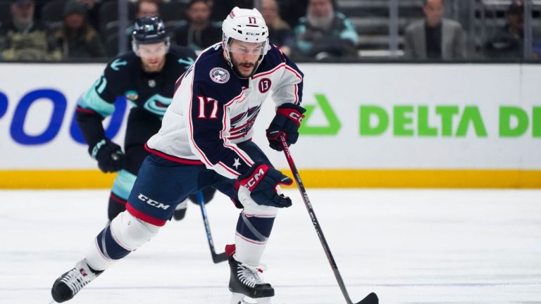Columbus Blue Jackets right wing Justin Danforth (17) moves the puck against the Seattle Kraken during the third period of an NHL hockey game Tuesday, Nov. 12, 2024, in Seattle. The Kraken won 5-2. (Lindsey Wasson/AP)