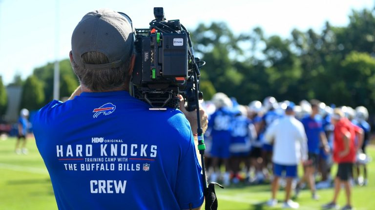 An NFL Films Hard Knocks cameraman films the Buffalo Bills during practice at the team's NFL football training camp, Wednesday, July 23, 2025, in Pittsford, N.Y. (Adrian Kraus/AP Photo)