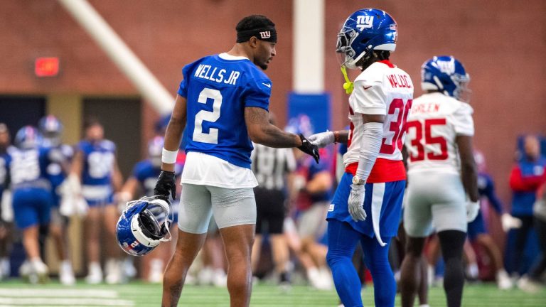 New York Giants wide receiver Juice Wells Jr. (2) greets free agent Former Philadelphia Eagles safety K'Von Wallace at the NFL football team's training camp, June 17, 2025, in East Rutherford, N.J. (Angelina Katsanis/AP)