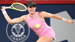 Rebecca Marino, of Canada, keeps her eyes on the ball during her first round match against Elsa Jacquemot, of France, at the National Bank Open tennis tournament in Montreal, Sunday, July 27, 2025. (Graham Hughes/THE CANADIAN PRESS)