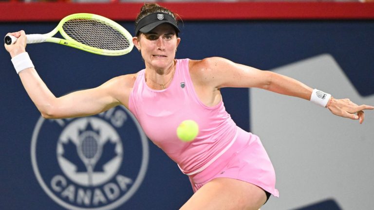 Rebecca Marino, of Canada, keeps her eyes on the ball during her first round match against Elsa Jacquemot, of France, at the National Bank Open tennis tournament in Montreal, Sunday, July 27, 2025. (Graham Hughes/THE CANADIAN PRESS)