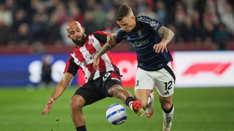 Brentford's Bryan Mbeumo, left, vies for the ball with Aston Villa's Lucas Digne during the English Premier League soccer match between Brentford and Aston Villa at the Gtech Community stadium in London, Saturday, March 8, 2025. (Kin Cheung/AP)