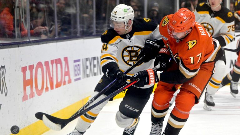 Boston Bruins defenseman Ian Mitchell, left, and Anaheim Ducks left wing Alex Killorn battle along the boards during the first period of an NHL hockey game Wednesday, March 26, 2025, in Anaheim, Calif. (Jayne-Kamin-Oncea/AP Photo)