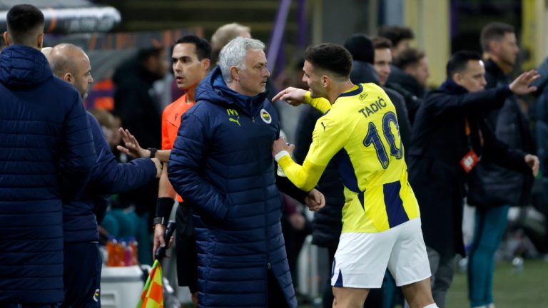 Fenerbahce's Dusan Tadic speaks with Fenerbahce's head coach Jose Mourinho during the Europa League playoff second leg soccer match between Anderlecht and Fenerbahce at the RSC Anderlecht stadium in Brussels, Thursday, Feb. 20, 2025. (Omar Havana/AP)