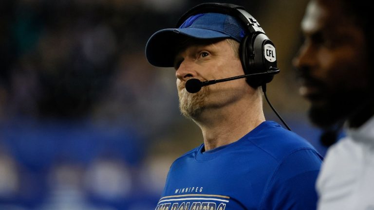 Winnipeg Blue Bombers head coach Mike O'Shea looks at the scoreboard against the Calgary Stampeders during second half CFL action in Winnipeg Friday, July 18, 2025. (John Woods/THE CANADIAN PRESS)