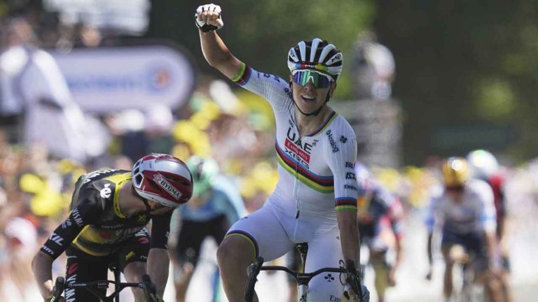 Slovenia's Tadej Pogacar celebrates as he crosses the finish line to win the seventh stage of the Tour de France cycling race over 197 kilometers (122.4 miles) with start in Saint-Malo and finish in Mur-de-Bretagne Guerledan, France. (Thibault Camus/AP)