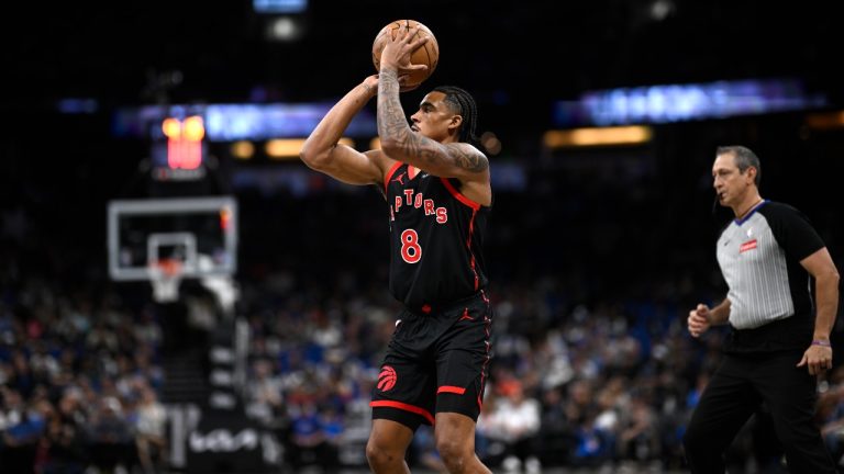 Toronto Raptors guard Jared Rhoden (8) goes up to shoot against the Orlando Magic during the second half of an NBA basketball game, Tuesday, March 4, 2025, in Orlando, Fla. (Phelan M. Ebenhack/AP)