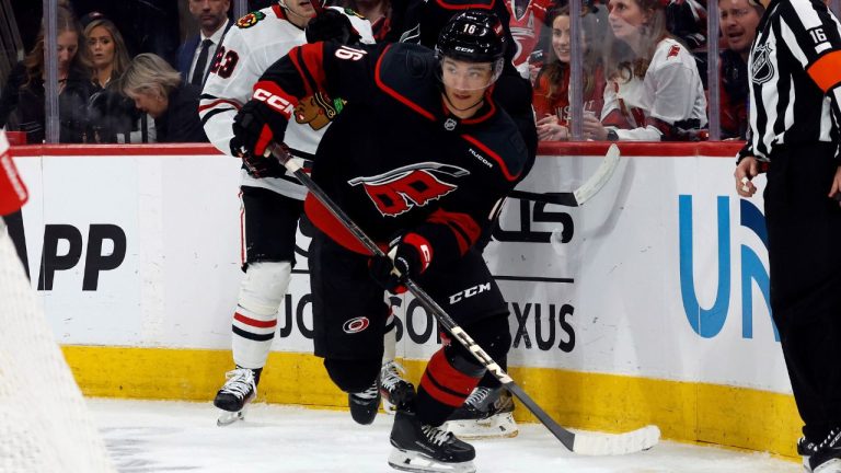 Carolina Hurricanes Ryan Suzuki (16) moves the puck against the Chicago Blackhawks during the third period of an NHL hockey game in Raleigh, N.C., Thursday, Jan. 30, 2025. (Karl DeBlaker/AP)