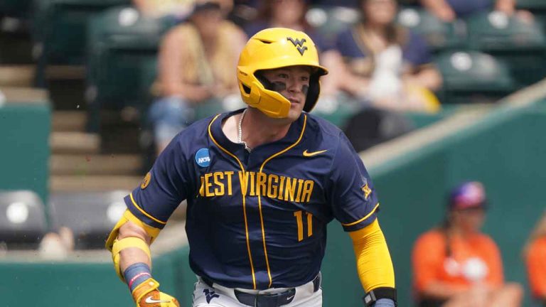 West Virginia infielder Sam White runs to first base during an NCAA regional baseball game against Kentucky. (Sean Rayford/AP)