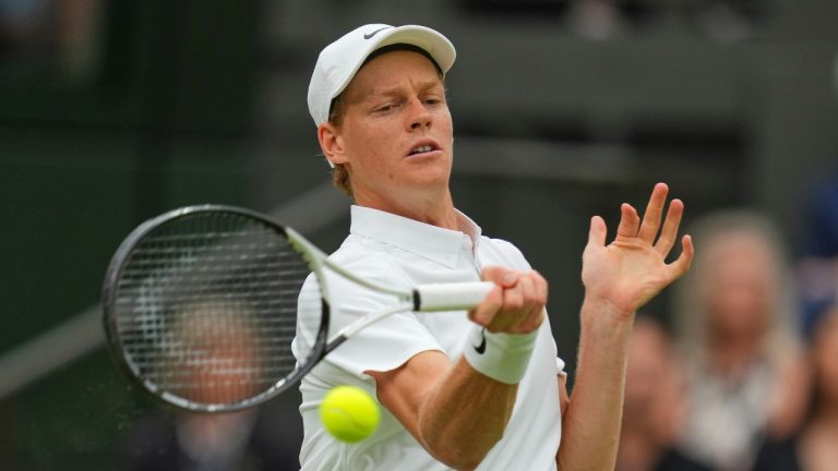 Jannik Sinner of Italy returns to Pedro Martinez of Spain during a third round men's singles match at the Wimbledon Tennis Championships in London, Saturday, July 5, 2025. (Kirsty Wigglesworth/AP Photo)