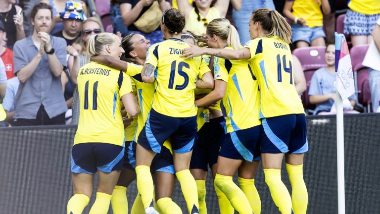 Sweden players celebrate their first goal of the game during the UEFA Women's EURO 2025 Group C soccer match between Denmark and Sweden at the Stade de Geneve stadium in Geneva, Switzerland, Friday, July 4, 2025. (Martial Trezzini/Keystone via AP)