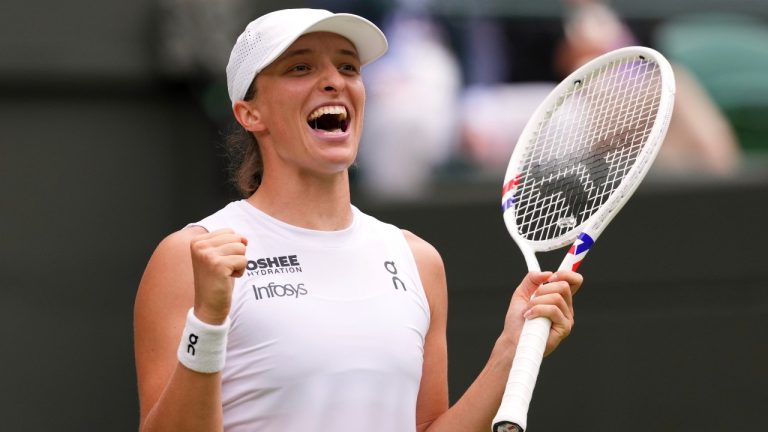 Iga Swiatek of Poland celebrates winning the women's singles quarterfinal match against Liudmilla Samsonova of Russia at the Wimbledon Tennis Championships in London, Wednesday, July 9, 2025.(Kirsty Wigglesworth/AP Photo)